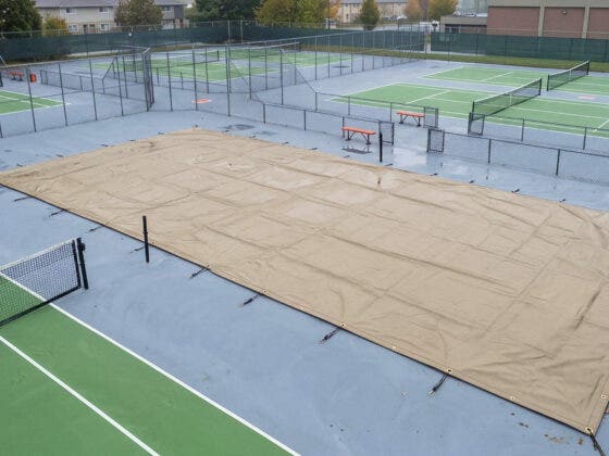 How Sports Tarpaulins Protect UK Grounds from Weather Damage