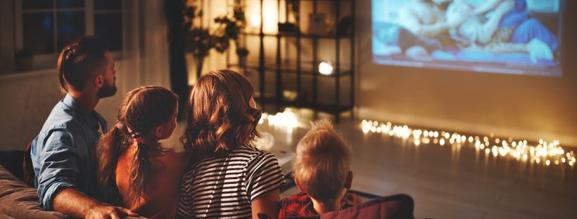 Young family watching movie together