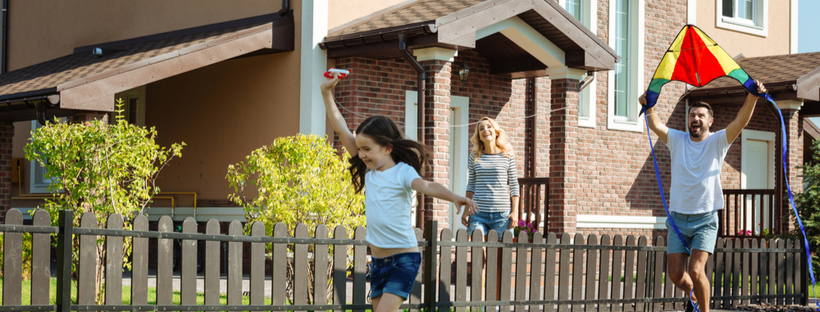 Young girl running with a kite